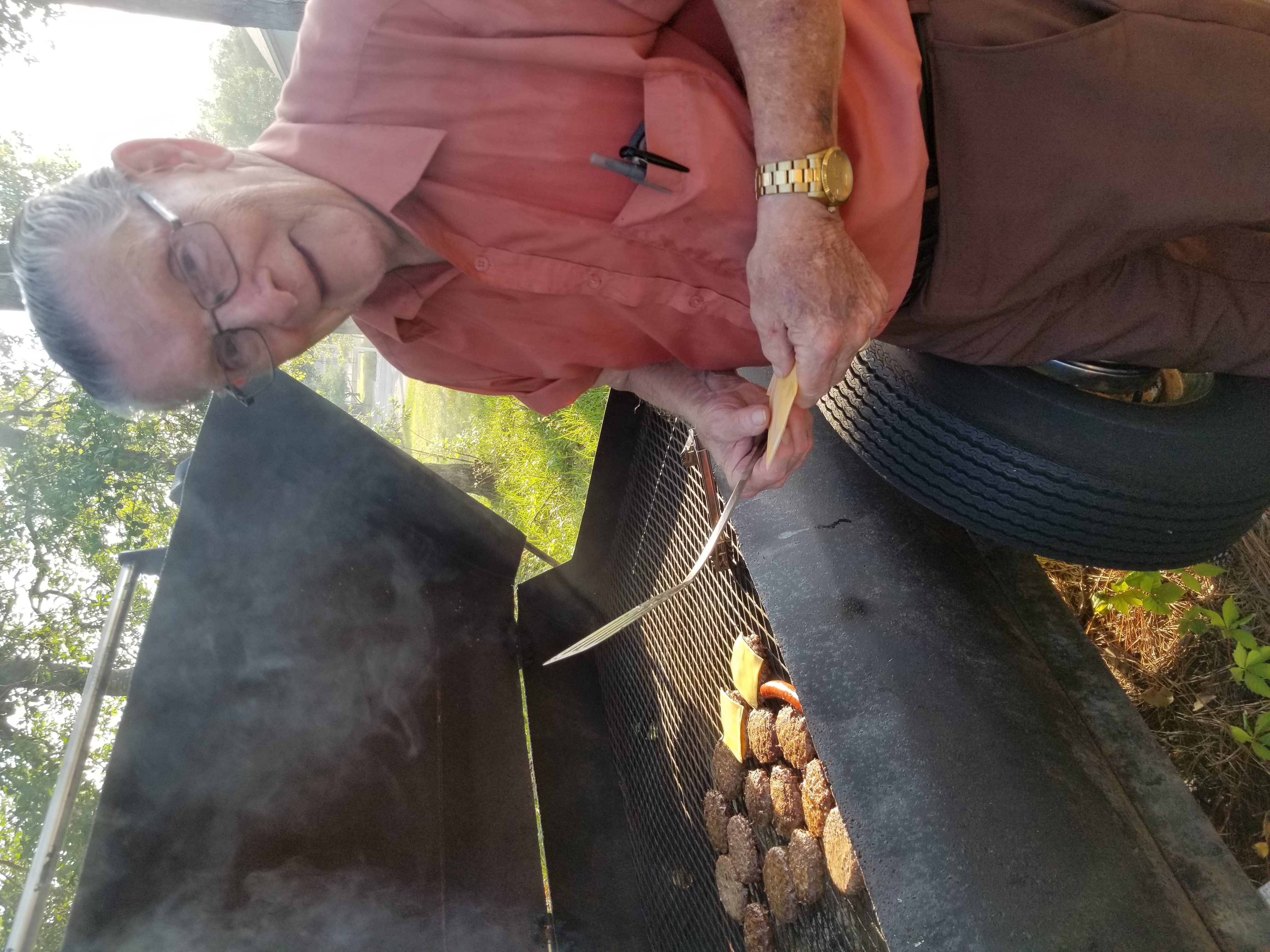 Men serving or grilling at church event